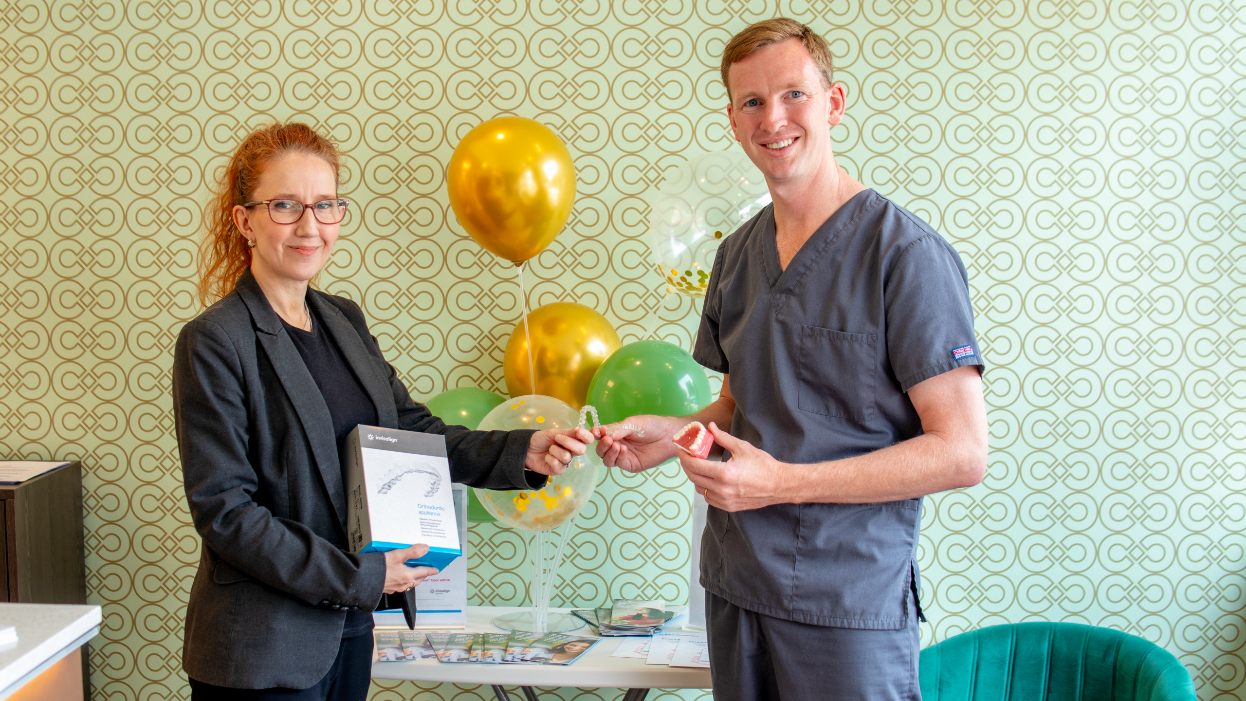 Dr. Murray celebrating with balloons